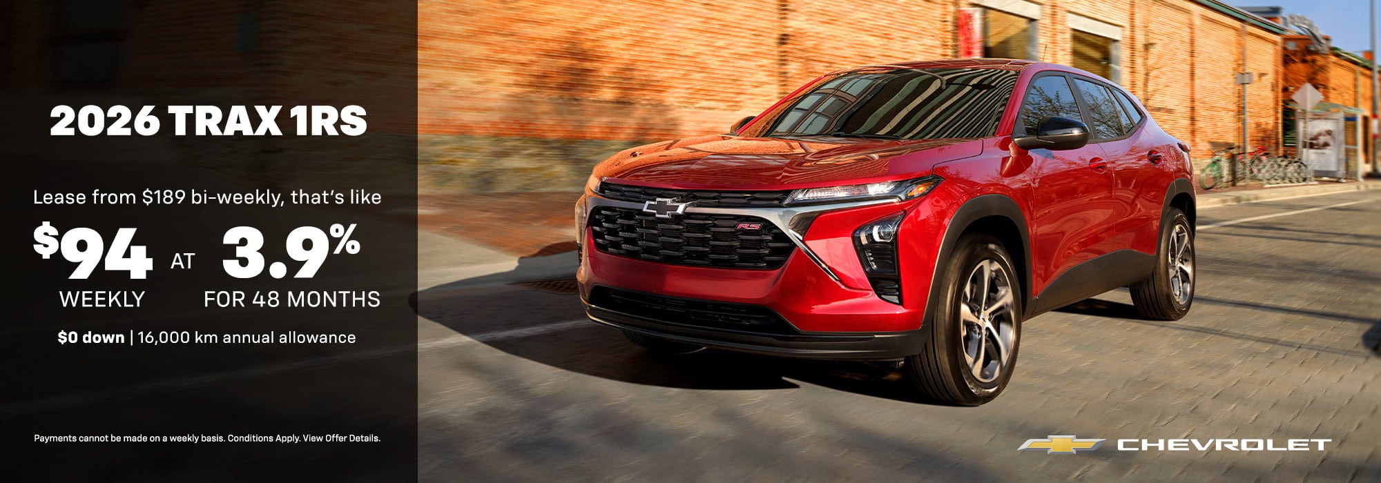 Red 2026 Chevrolet Trax 1RS driving on a street. Lease offer: $94 weekly at 3.9% for 48 months.