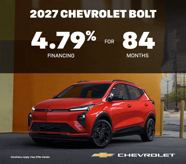 2027 Chevrolet Bolt offer: 4.79% financing for 84 months. Red car in urban setting.