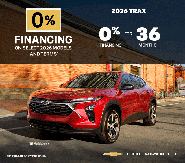 Red 2026 Chevrolet Trax 1RS SUV on a street; lease offer $94 weekly at 3.9% for 48 months, $0 down.