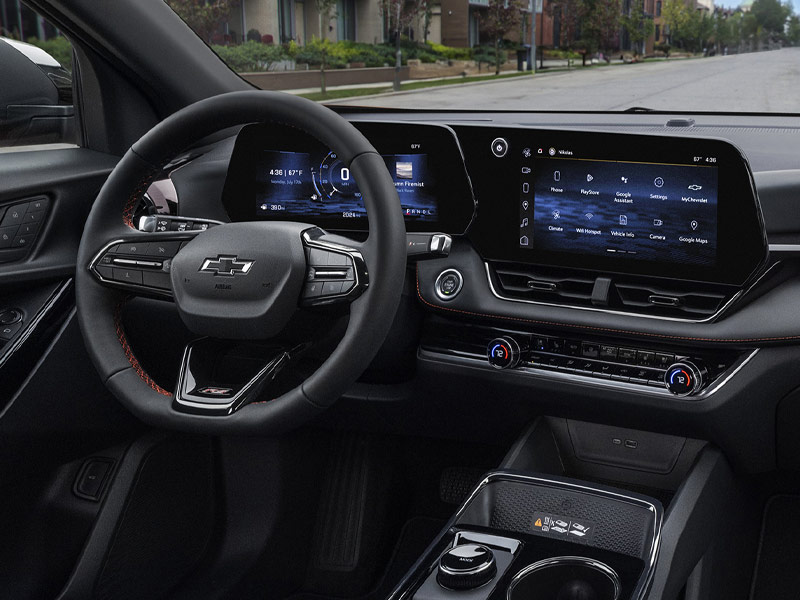 The driver's view of a Chevrolet Equinox RS, showing the instrument cluster, infotainment screen and the road ahead