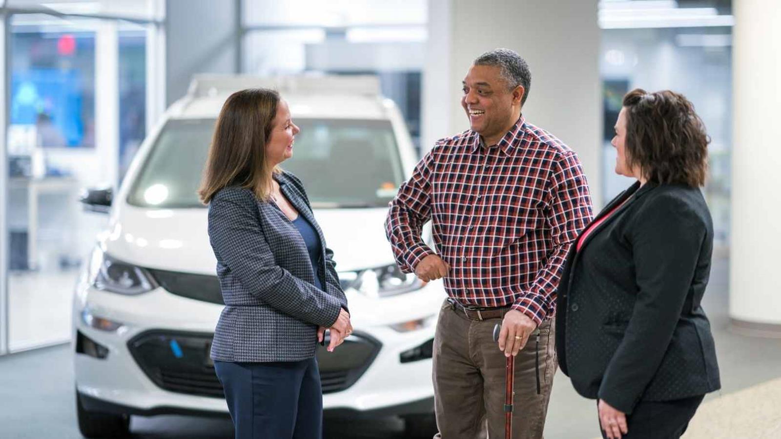 A member of the RMP Chevrolet team talking with a customer in the showroom